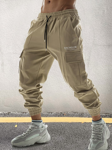 Loose Fit Men's Letter Graphic Cargo Pants With Flap Pockets And Drawstring Waist