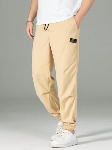Men's Casual Drawstring Jogger Pants With Letter Label And Slanted Pockets